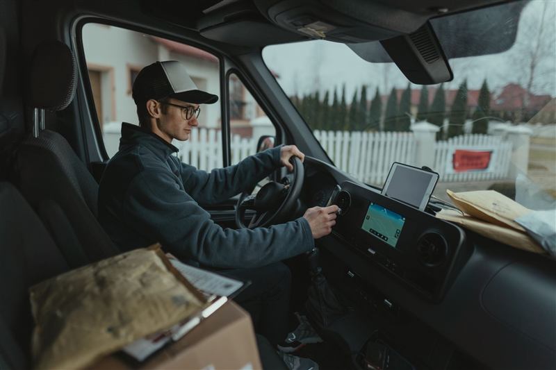 Courier driving a van