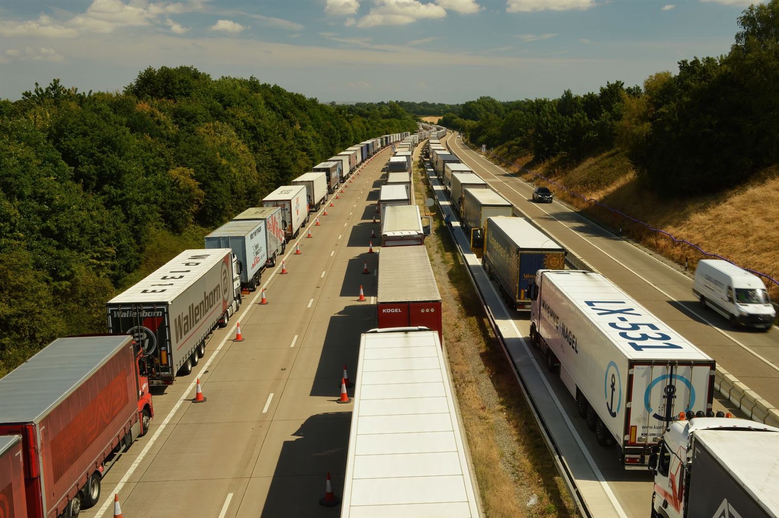 Lorries queued on an English motorway seen from above