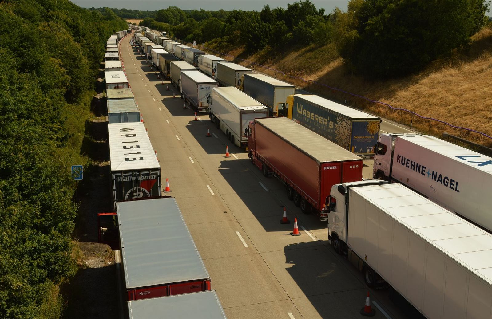 Queues of lorries on an English motorway seen from above